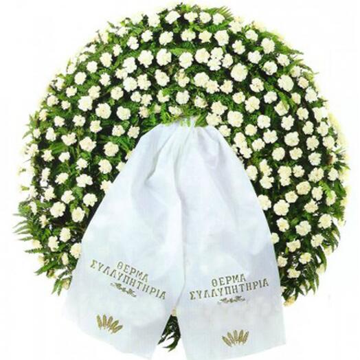 Tripod funeral wreath with white carnations