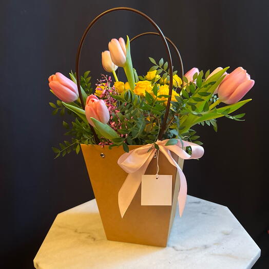Flower gift in a bag with Tulips and Roses