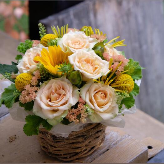 Small Orange Bouquet basket with mixed flowers and greenery