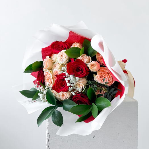 Red roses with creme spray roses and ruscus