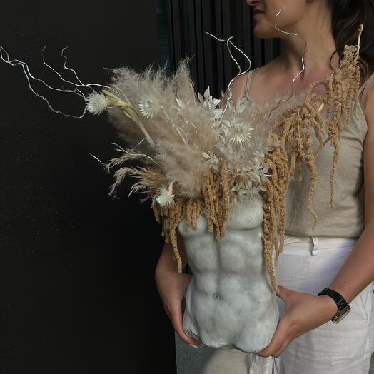 Man's body with dry flowers