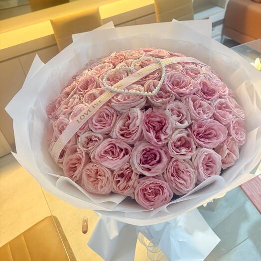 65 roses with pearl heart