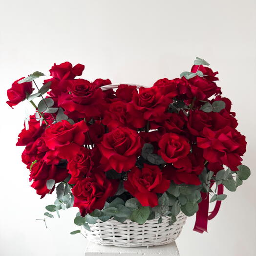 French red roses with eucalpytus in a basket