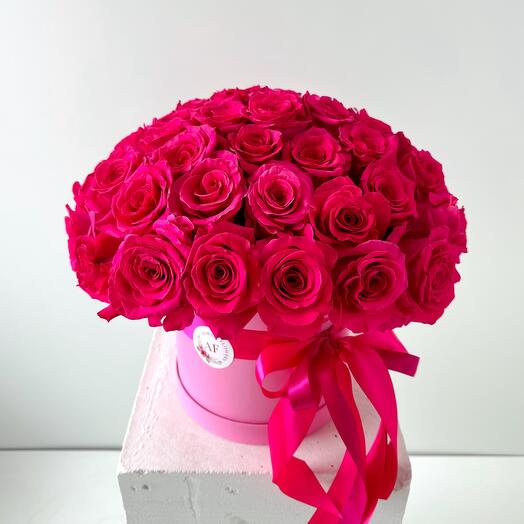 Dark pink roses in a box