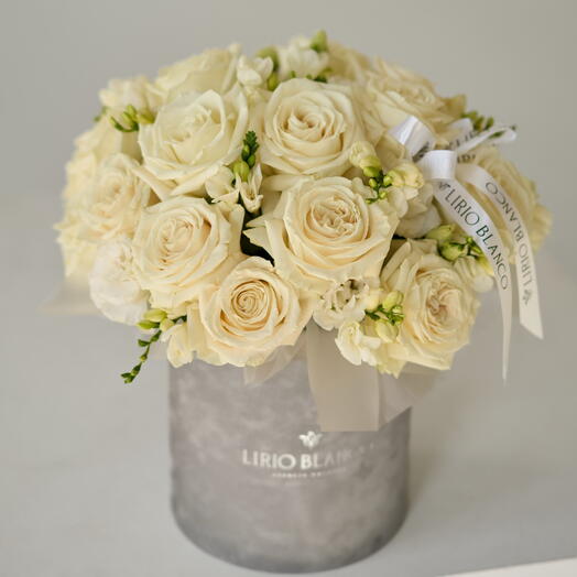 White rose and freesia in a box