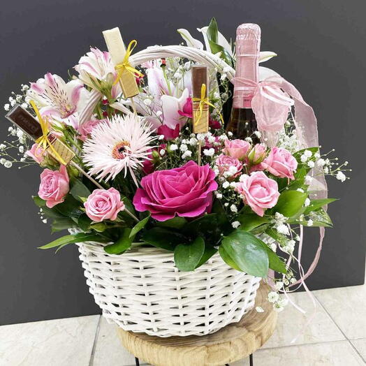 Luxury flower basket with champagne and chocolates