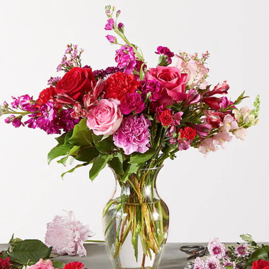 Regal Jewel (carnation, red roses, snap, stock + vase)