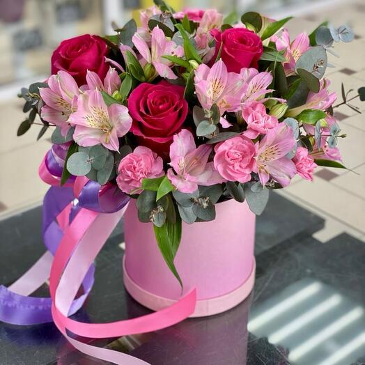 Flowers in box with red roses