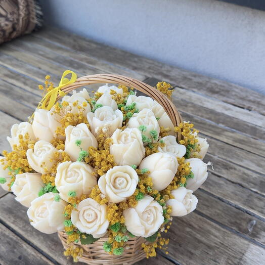 Basket of spring cream tulips, candles