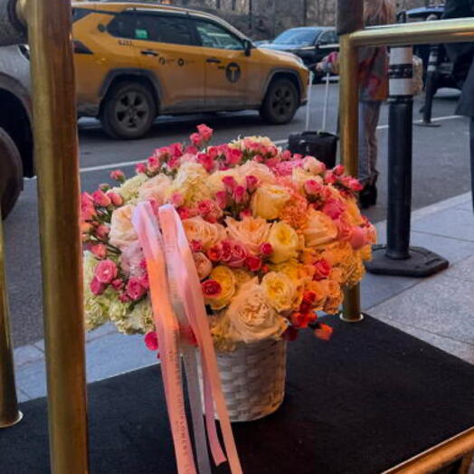 Flowers in basket with spray roses