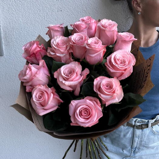 15 pink roses in kraft paper
