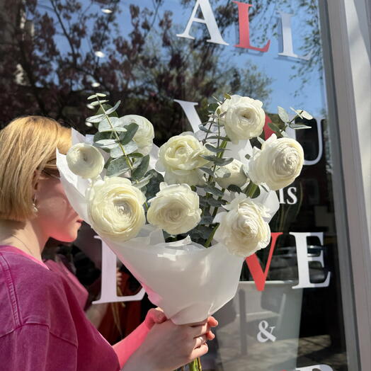 10 white ranunculus and eucalyptus