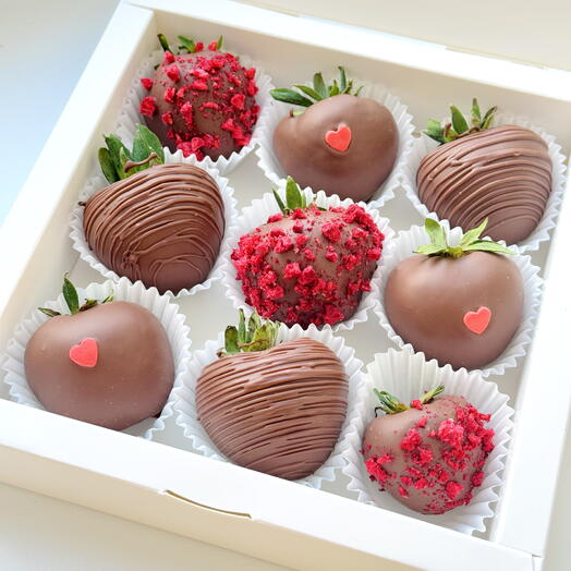 Strawberries in chocolate hearts and red