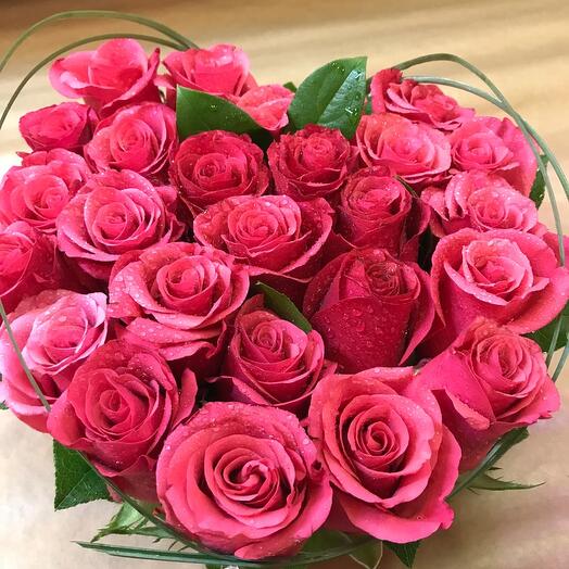 Heart-shaped bouquet of 31 pale pink roses.