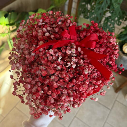 Heart-shaped box of red gypsophila