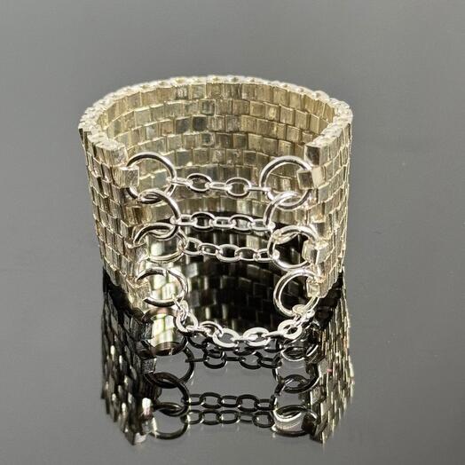Square beaded ring with decoration