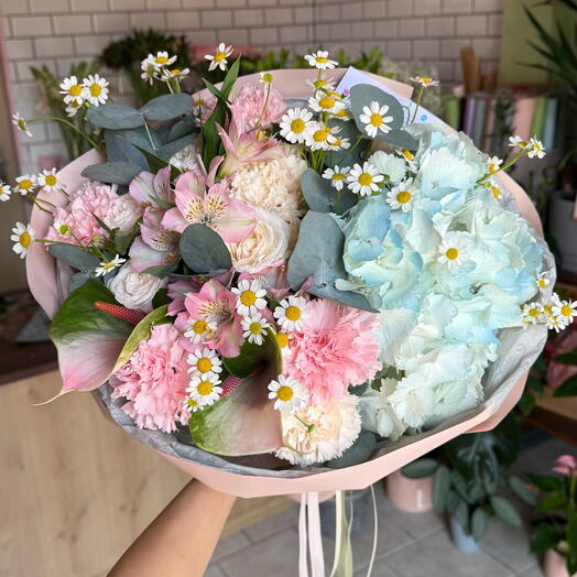Spring flower bouquet with hydrangea and chamomile