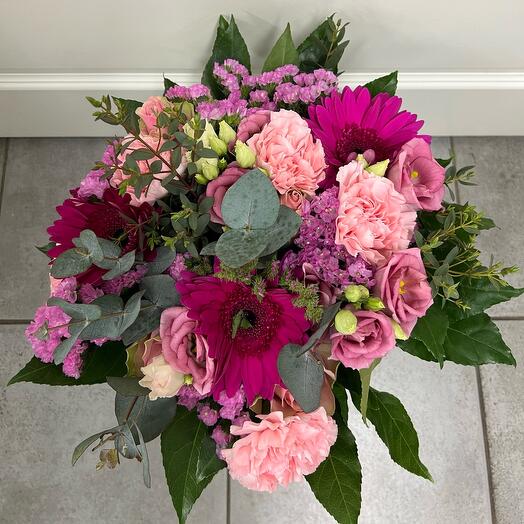 A bouquet of flowers in Aidin's arms