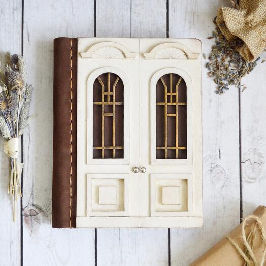 White wooden journal with door
