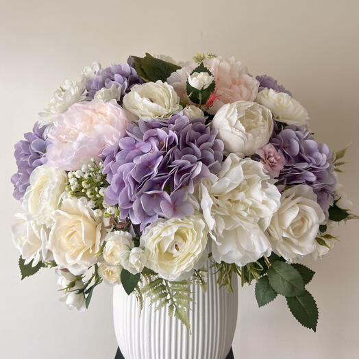 Large white and purple artifical Flowers bouquet in a vase
