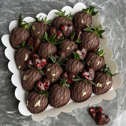 Strawberries and cuttlefish in dark chocolate