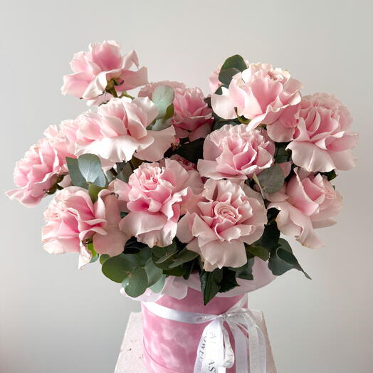 Pink french roses with eucalyptus in a box