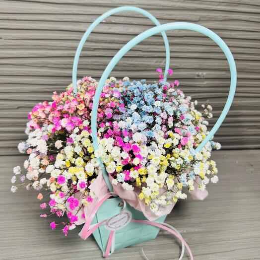 Composition of colored gypsophila in a box