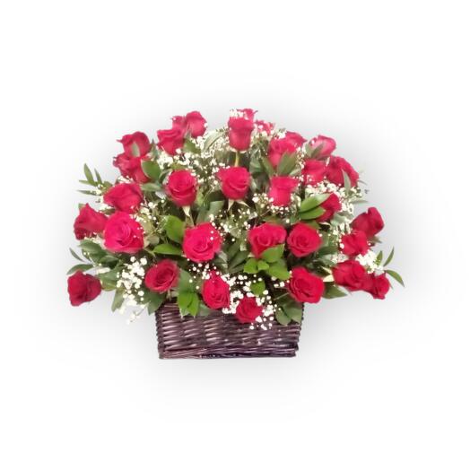 Love is in the air. Flowers in basket. rose