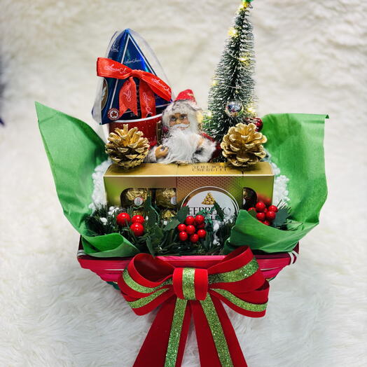 Winter hamper with Santa , coffee mug, chocolates and so on