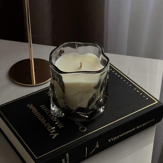 Aroma candle in a crumpled glass