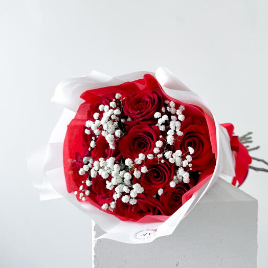 Red roses with white gypsophila bouquet