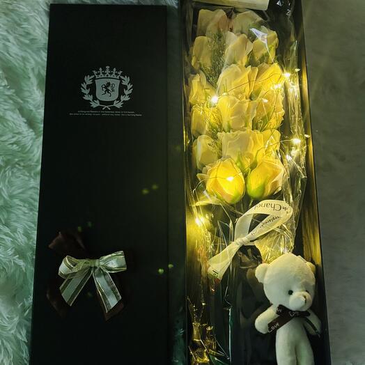 Beige color Flowers in a box with teddy bear and led light installed for your special occasion
