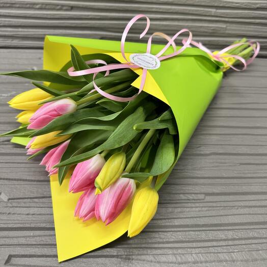 Bouquet of 11 pink and yellow tulips in festive packaging