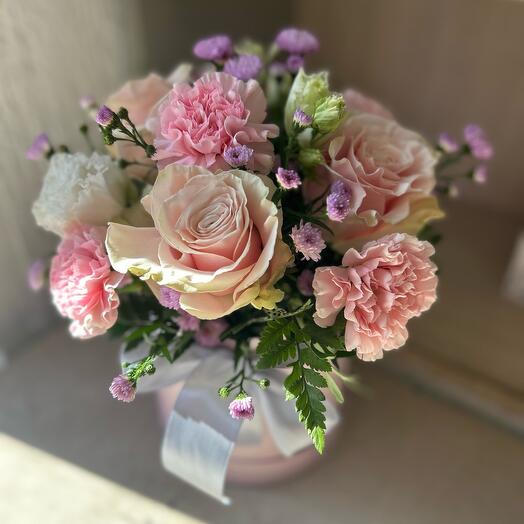 Flowers in a box of roses and carnations