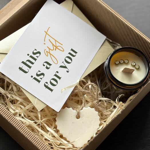 Box with a gift certificate, soy candle, and scented sachet