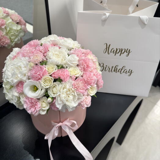 Flowers in a pink box with flowers