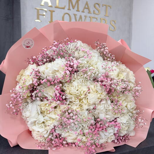 White hydrangeas bouquet with pink gypsophila