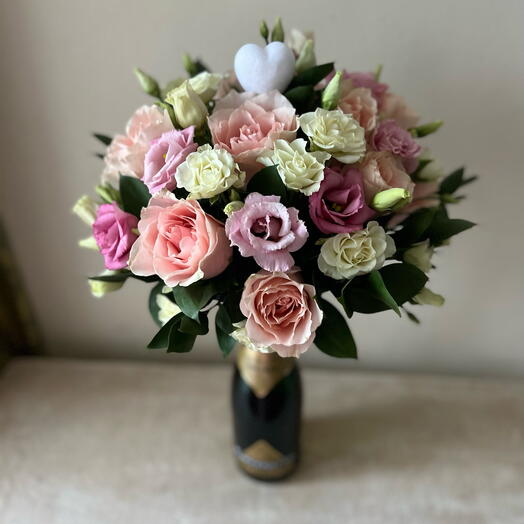 Elegant  bottle of champagne with flowers