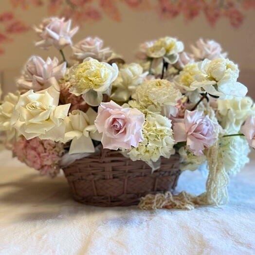 Basket with open roses and peonies
