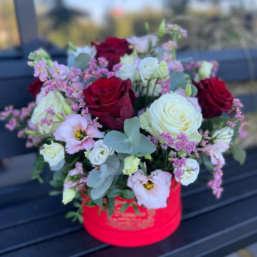 Flowers mix with roses in a box