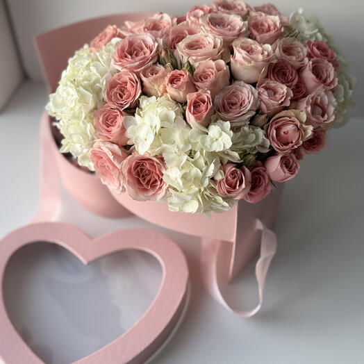 Flowers in a pink heart shape box