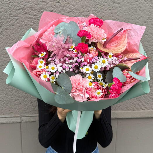 Spring flower bouquet with tulips and daises