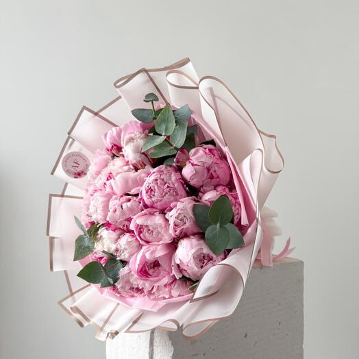 Pink peonies bouquet with eucalyptus