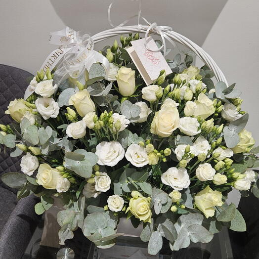 Flowers in a basket in white tones