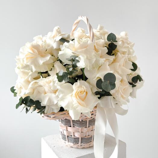 French white roses in basket with eucalyptus