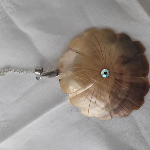 Caren, Carved flower with crystal pendant