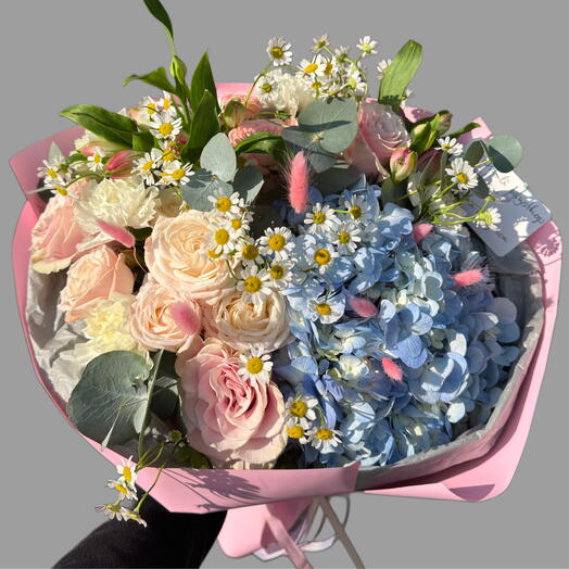Bouquet of flowers with blue hydrangea and roses