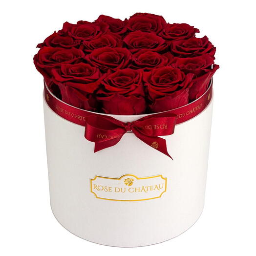 Roses éternelles rouges dans une boîte ronde blanche